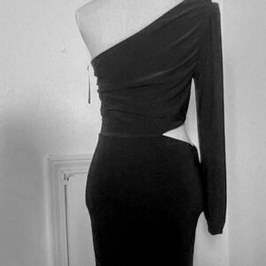 Black dress , comfy and stretchy runs a little smaller